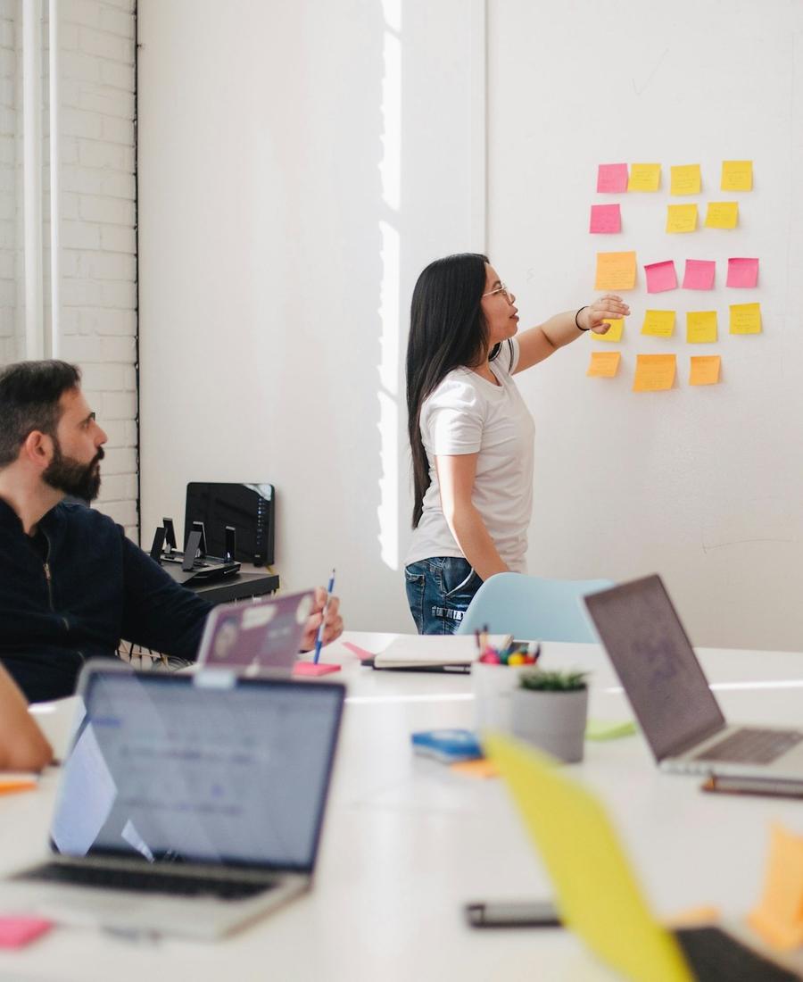 Marketing team planning a campaign strategy on a whiteboard